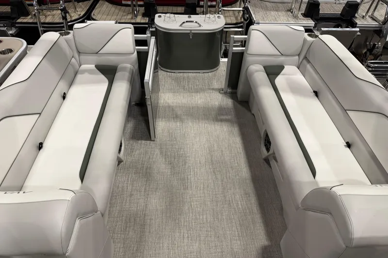 Slide: The Image of 2025 Avalon 2385 VENTURE QL boat interior with sleek white seating and modern design. - 7