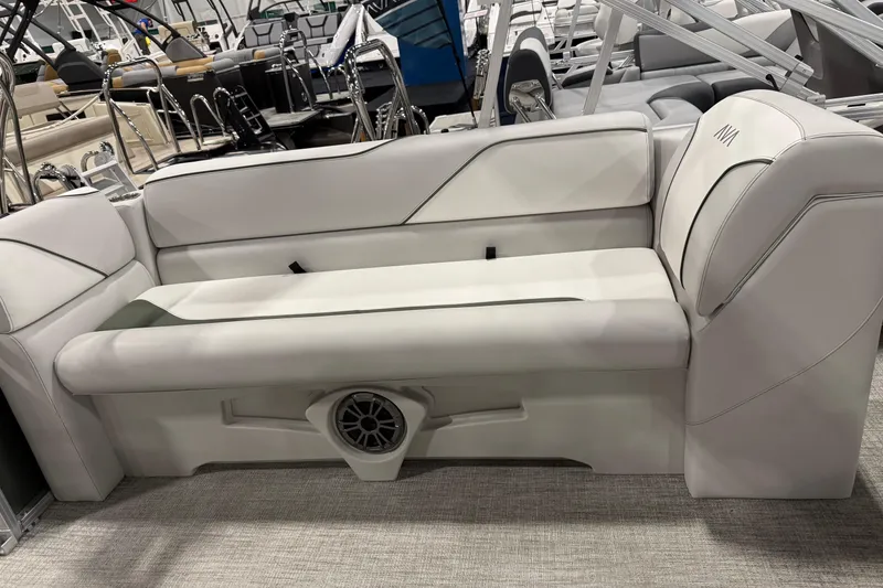 Slide: The Image of Luxurious seating on 2025 Avalon 2385 VENTURE QL boat, featuring sleek design and integrated speaker. - 8