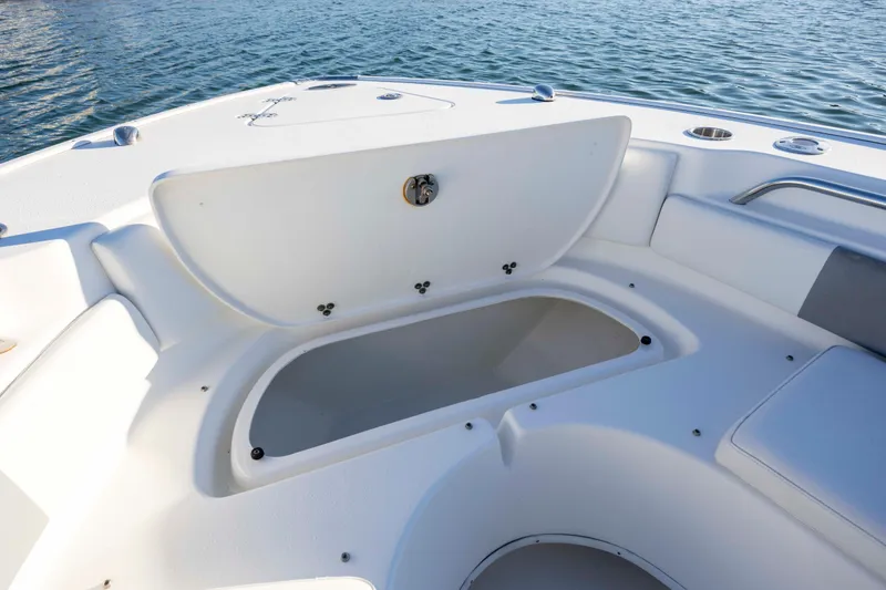 Slide: The Image of 2014 Cape Horn 27 XS boat with open storage compartment on deck. - 13