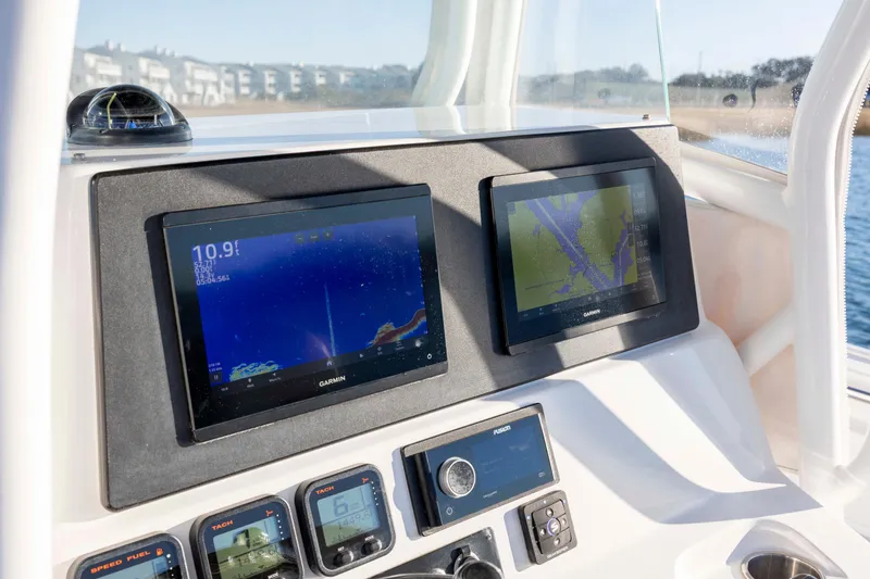 Slide: The Image of Dashboard of 2014 Cape Horn 27 XS boat with Garmin navigation displays. - 20