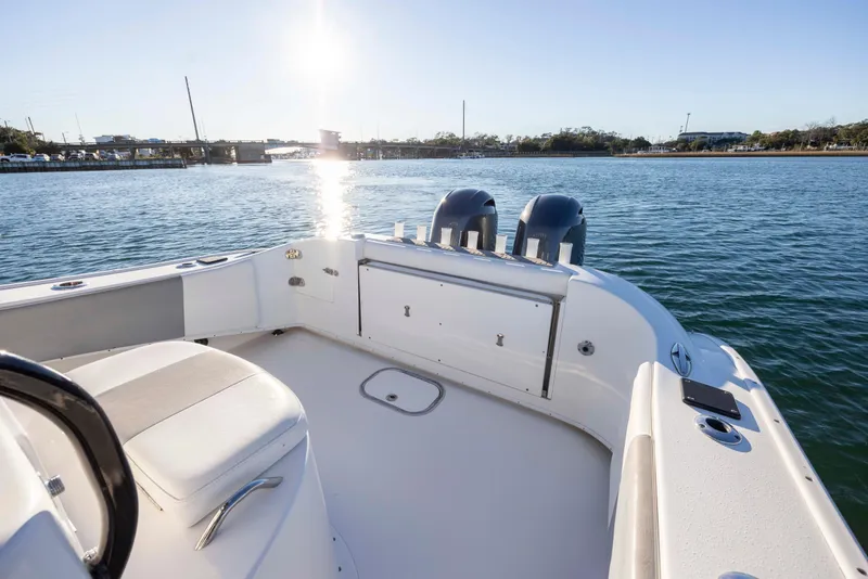 Slide: The Image of 2014 Cape Horn 27 XS boat on water, sunny day, dual engines, spacious deck. - 22