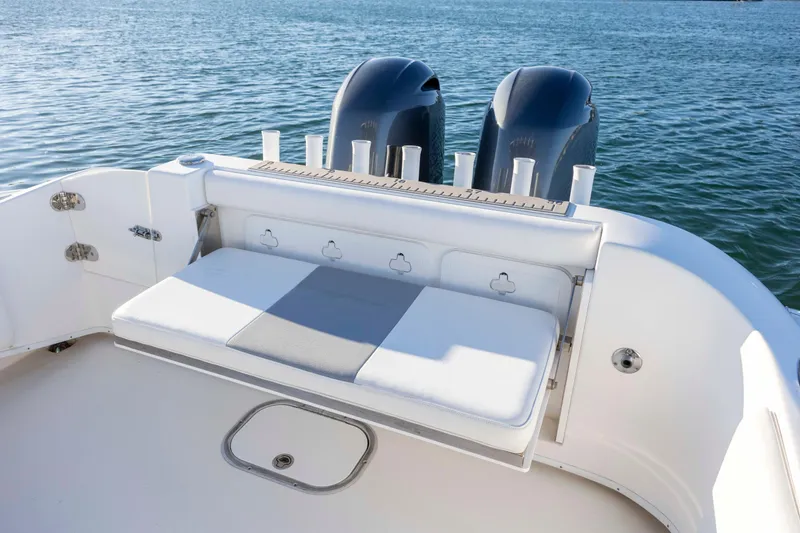 Slide: The Image of 2014 Cape Horn 27 XS boat with dual engines and cushioned seating. - 24