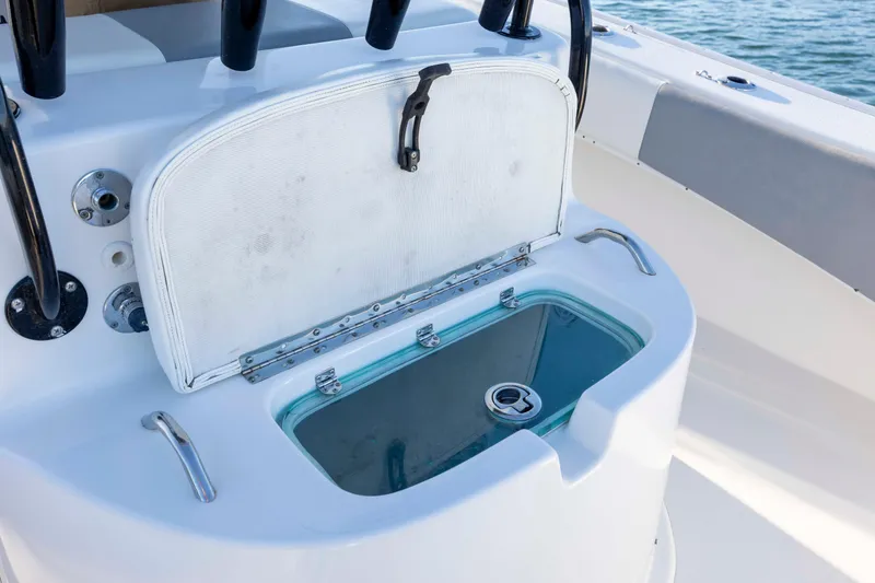 Slide: The Image of Livewell on 2014 Cape Horn 27 XS boat, open lid, ocean background. - 28