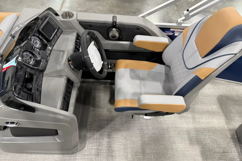 Slide: The Image of Captain's chair and dashboard of 2026 Avalon 2385 LSZ VRB boat, featuring modern controls. - 6