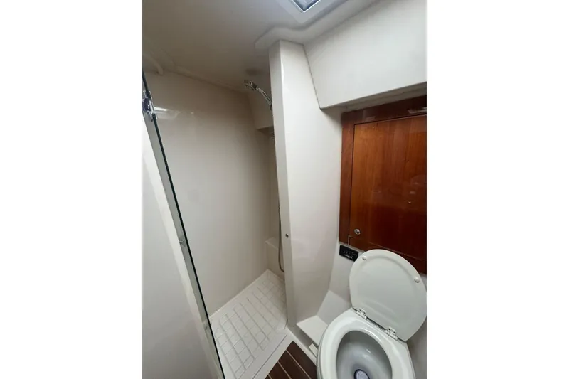 Slide: The Image of Bathroom interior of 2009 Riviera 4700 Sport Yacht with shower and toilet. - 7