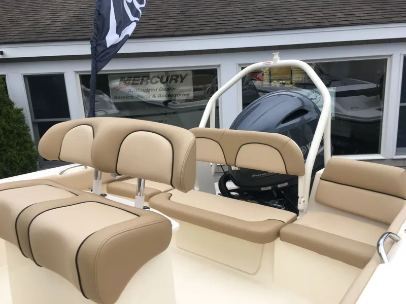 Slide: The Image of Scout 195 Sportfish 2017 with beige seats and outboard motor. - 2