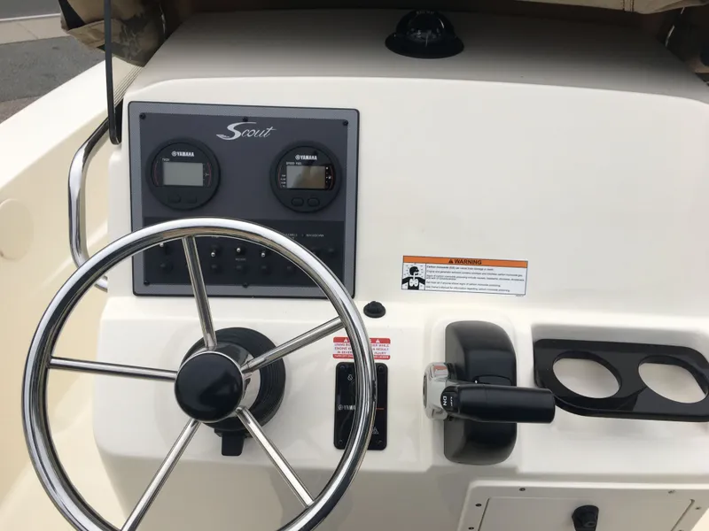 Slide: The Image of Steering console of a 2017 Scout 195 Sportfish boat. - 3