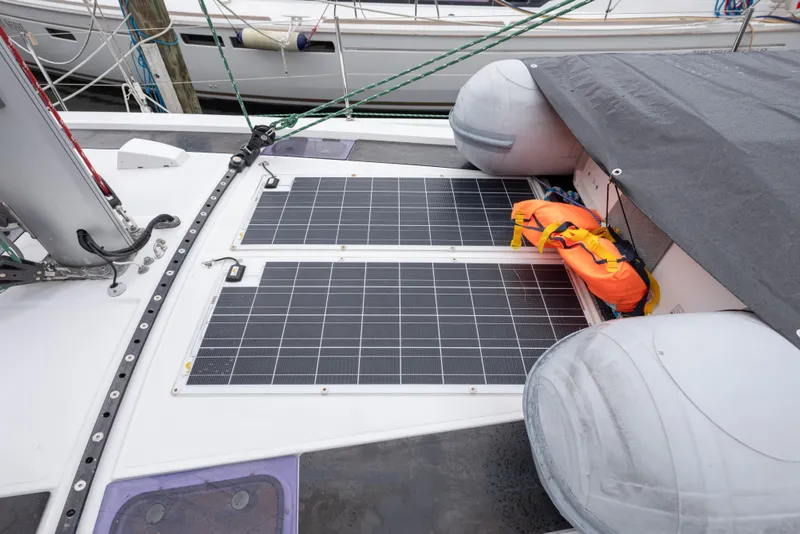 Slide: The Image of Beneteau Oceanis 46.1 (2020) with solar panels and life jacket on deck. - 10