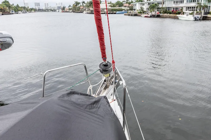 Slide: The Image of Bow view of 2020 Beneteau Oceanis 46.1 sailboat in a calm marina. - 11