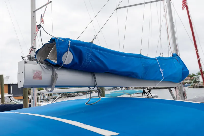 Slide: The Image of 2020 Beneteau Oceanis 46.1 sailboat with blue sail cover in marina. - 14