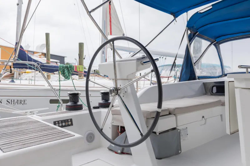 Slide: The Image of Cockpit of 2020 Beneteau Oceanis 46.1 sailboat with steering wheel and seating. - 17