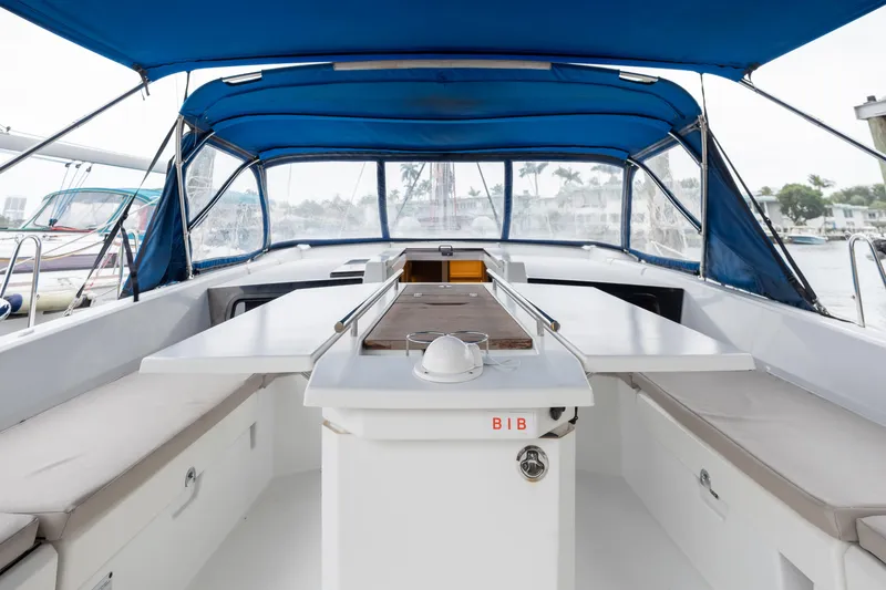 Slide: The Image of 2020 Beneteau Oceanis 46.1 yacht cockpit with blue canopy and seating area. - 23