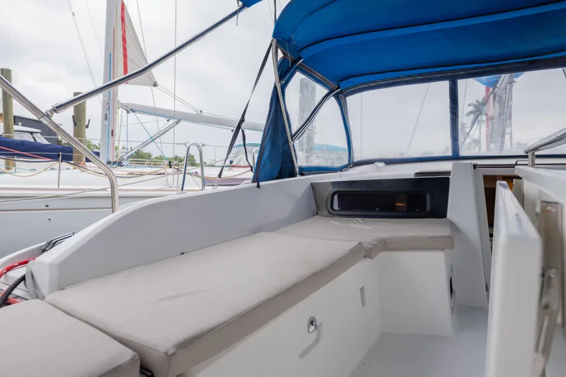Slide: The Image of 2020 Beneteau Oceanis 46.1 yacht cockpit with blue canopy and comfortable seating. - 24
