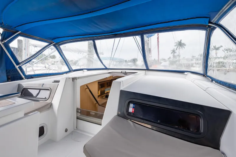 Slide: The Image of Interior view of 2020 Beneteau Oceanis 46.1 sailboat with blue canopy and modern design. - 25