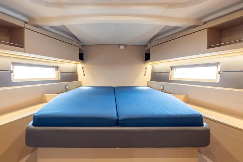 Slide: The Image of Luxurious cabin interior of 2020 Beneteau Oceanis 46.1 yacht with blue bedding. - 27
