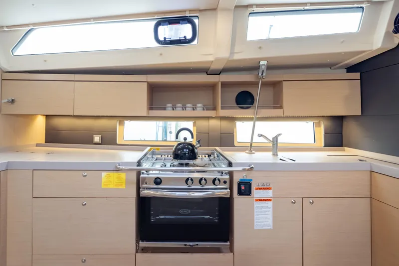 Slide: The Image of Modern kitchen interior of 2020 Beneteau Oceanis 46.1 yacht with stove and sink. - 33