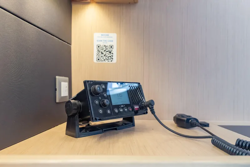 Slide: The Image of VHF radio on Beneteau Oceanis 46.1 yacht, 2020 model, with QR code on wall. - 36