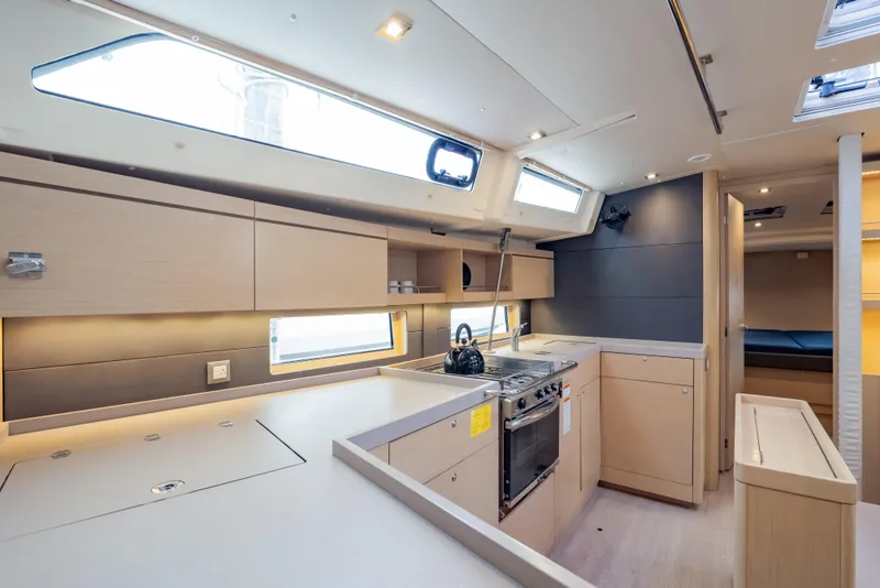 Slide: The Image of Modern kitchen interior of 2020 Beneteau Oceanis 46.1 yacht, featuring sleek cabinetry and appliances. - 37