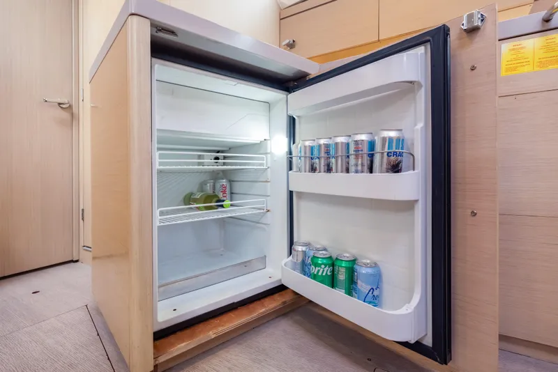 Slide: The Image of Mini fridge stocked with drinks inside a 2020 Beneteau Oceanis 46.1 yacht. - 38