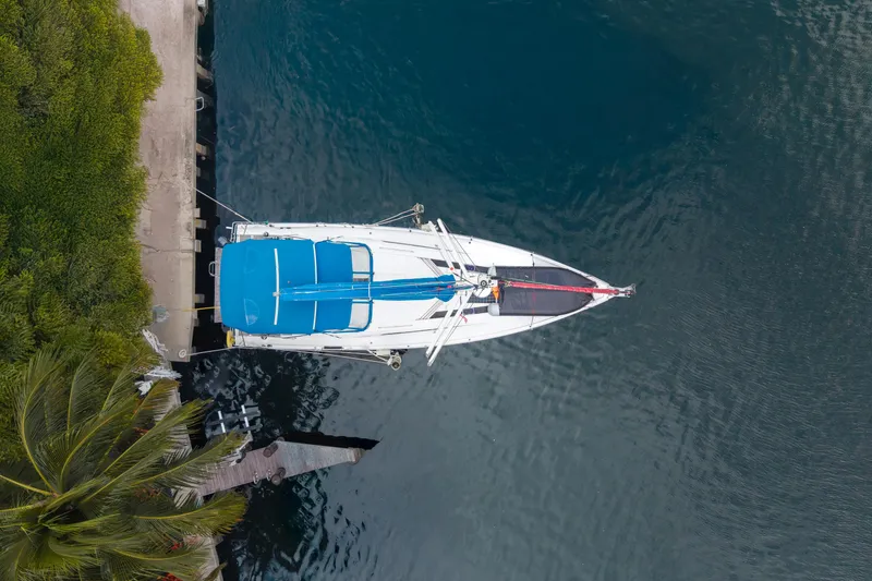 Slide: The Image of Aerial view of 2020 Beneteau Oceanis 46.1 yacht docked by lush greenery. - 40
