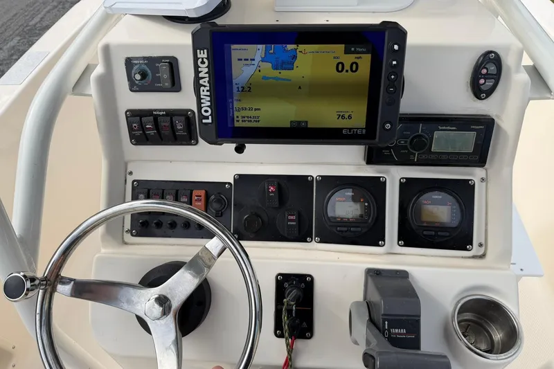 Slide: The Image of 2007 Key West 176 Sportsman CC dashboard with Lowrance navigation system and Yamaha controls. - 12