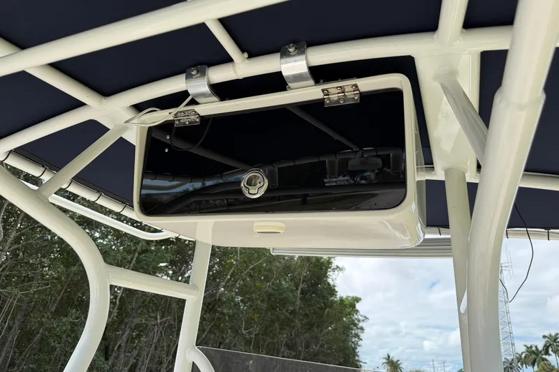 Slide: The Image of T-top storage compartment on a 2007 Key West 176 Sportsman CC boat. - 17