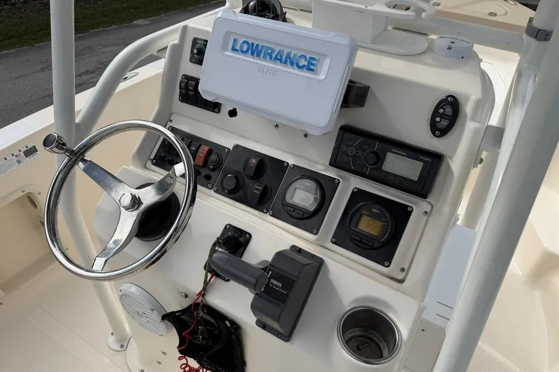 Slide: The Image of 2007 Key West 176 Sportsman CC boat dashboard with Lowrance Elite system and steering wheel. - 18
