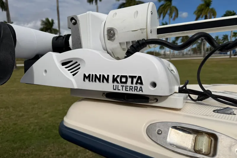 Slide: The Image of Minn Kota Ulterra motor on 2007 Key West 176 Sportsman CC boat, palm trees in background. - 21