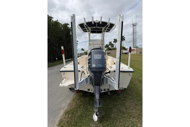 Slide: The Image of 2007 Key West 176 Sportsman CC boat with Yamaha outboard motor, parked on grass. - 4