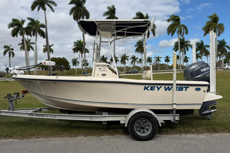 Slide: The Image of 2007 Key West 176 Sportsman CC boat on trailer, palm trees in background. - 6