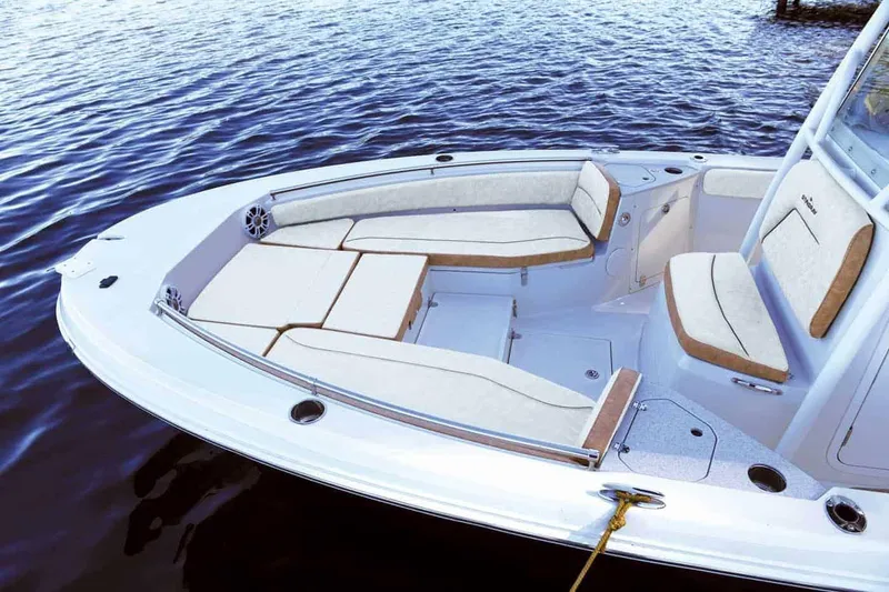Slide: The Image of Manufacturer Provided Image: 2025 Stingray 236 CC boat with spacious seating on calm water. - 14