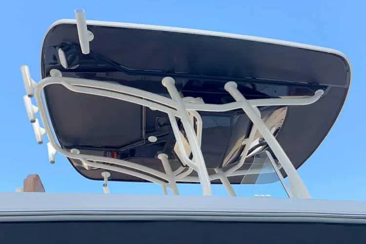 Slide: The Image of Manufacturer Provided Image: 2025 Stingray 236 CC boat T-top against clear blue sky. - 15