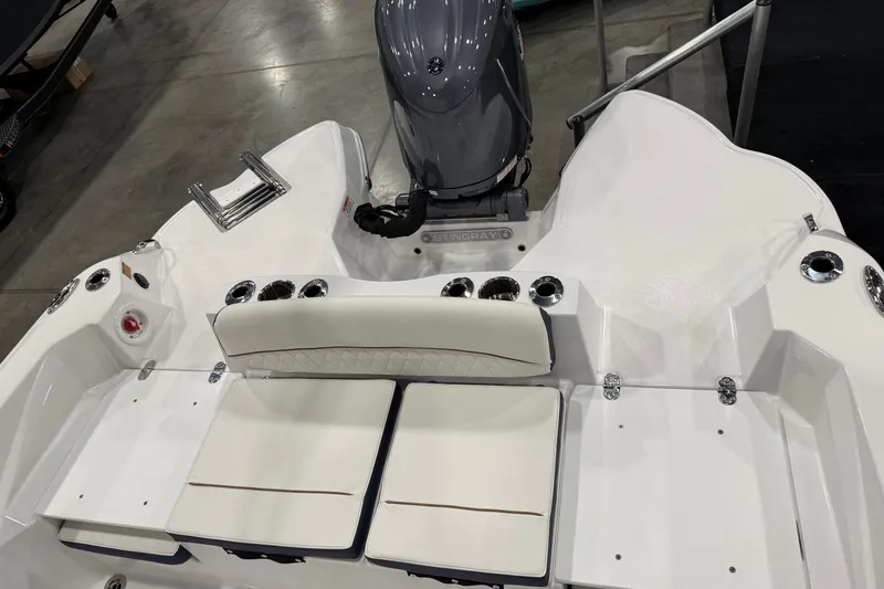 Slide: The Image of 2026 Stingray 236 CC boat interior with seating and motor, showcasing modern design. - 5