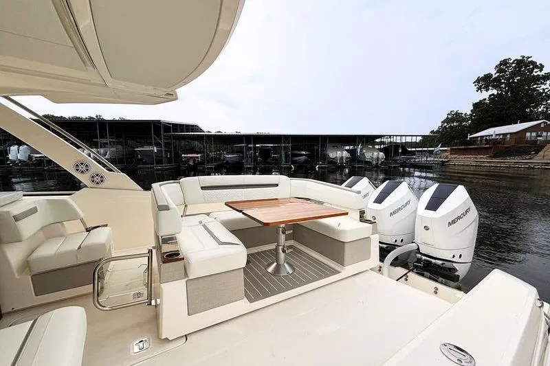 Slide: The Image of Luxurious 2025 Tiara Yachts 38 LS with elegant seating and powerful Mercury outboard engines. - 16