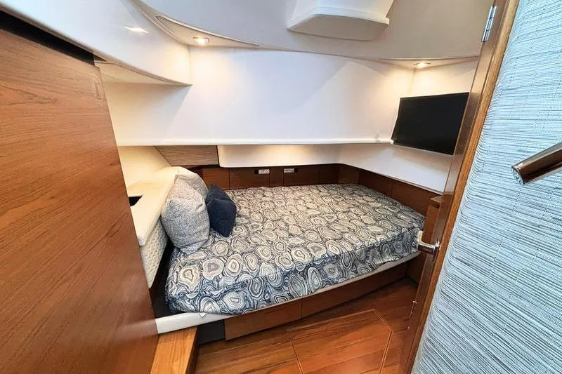 Slide: The Image of Luxurious cabin interior of 2025 Tiara Yachts 38 LS with cozy bedding and modern design. - 19