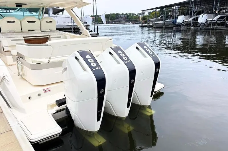 Slide: The Image of 2025 Tiara Yachts 38 LS with triple 400 V10 Mercury outboard engines docked. - 3