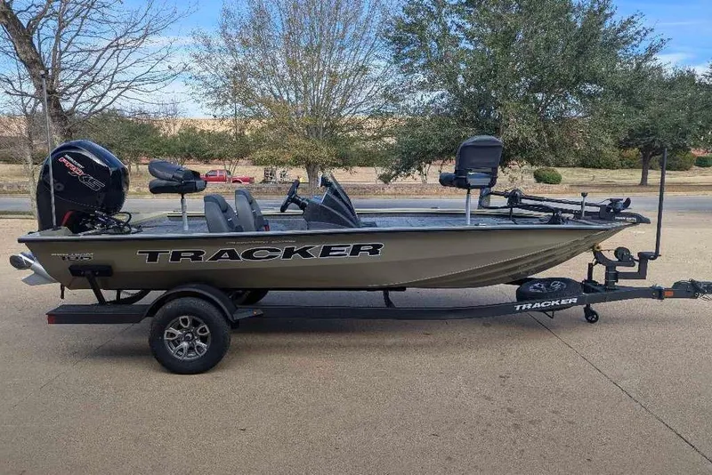 The Image of 2026 Tracker Pro Team 195 boat on trailer, parked outdoors. - 0