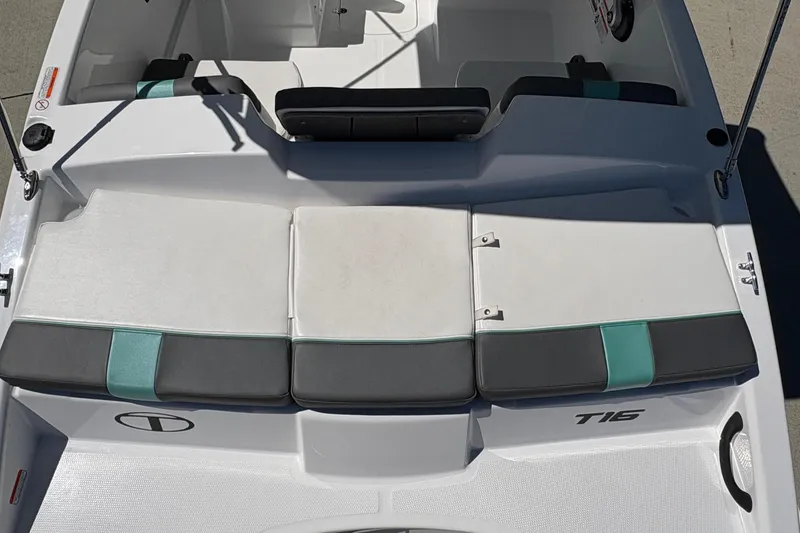 Slide: The Image of The image shows the stern of a Tahoe T16 boat with cushioned seats and a modern design. - 20