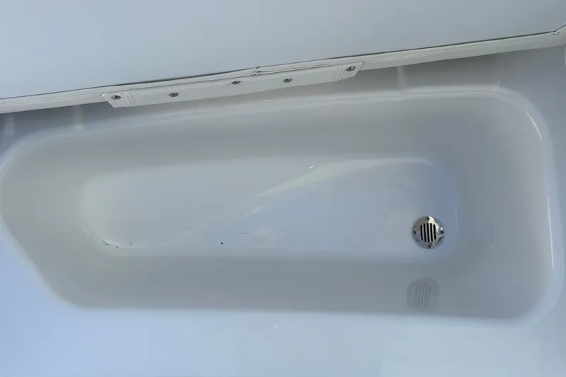Slide: The Image of White bathtub interior with drain, Tahoe T16 model, 2026. - 35