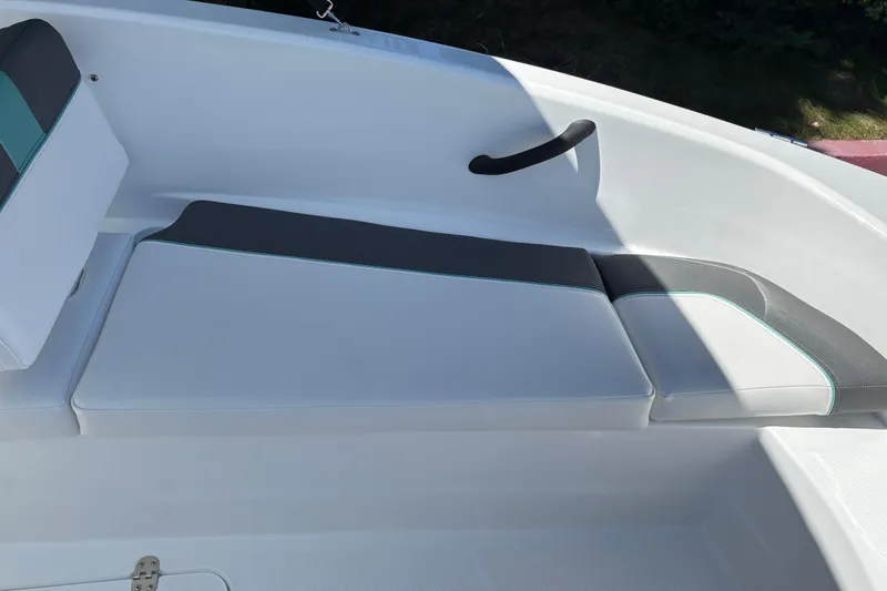 Slide: The Image of 2026 Tahoe T16 boat interior with sleek white and gray seating design. - 38