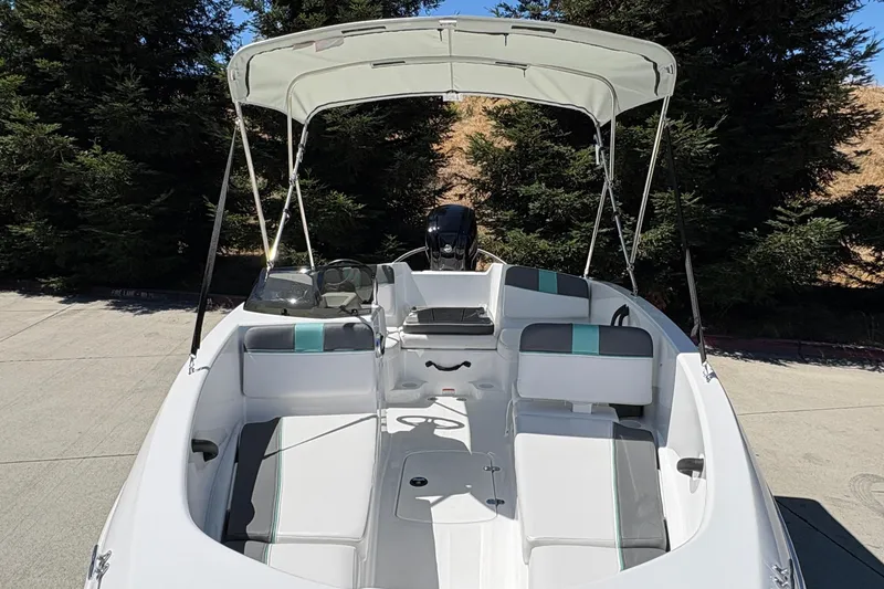 Slide: The Image of 2026 Tahoe T16 boat with canopy, featuring spacious seating and modern design. - 14
