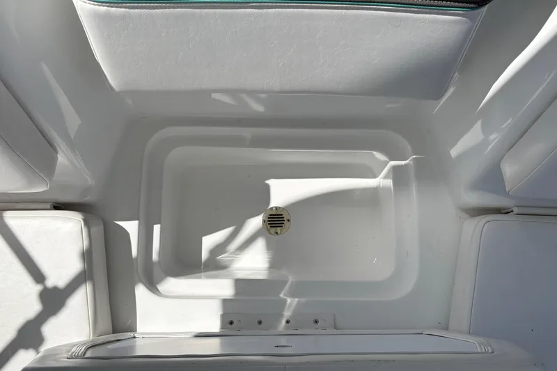 Slide: The Image of Interior view of 2026 Tahoe T16 boat, featuring a white compartment with a drain. - 21