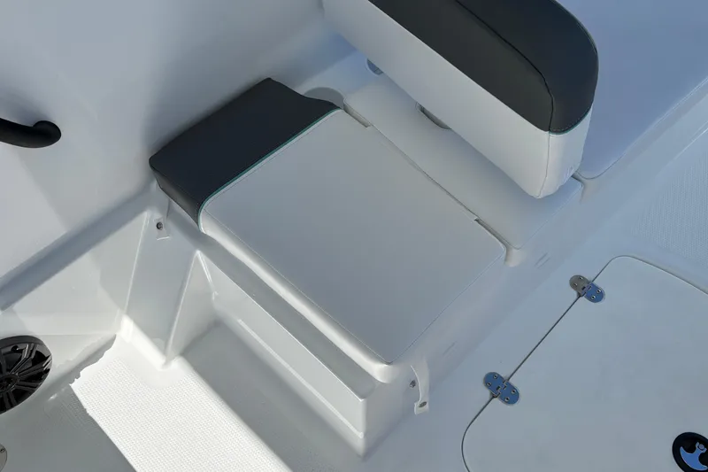Slide: The Image of 2026 Tahoe T16 boat interior seating with storage compartment and speaker. - 32