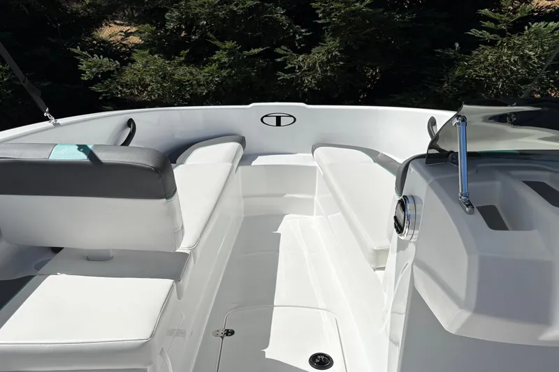 Slide: The Image of 2026 Tahoe T16 boat interior with white seating and sleek design. - 19