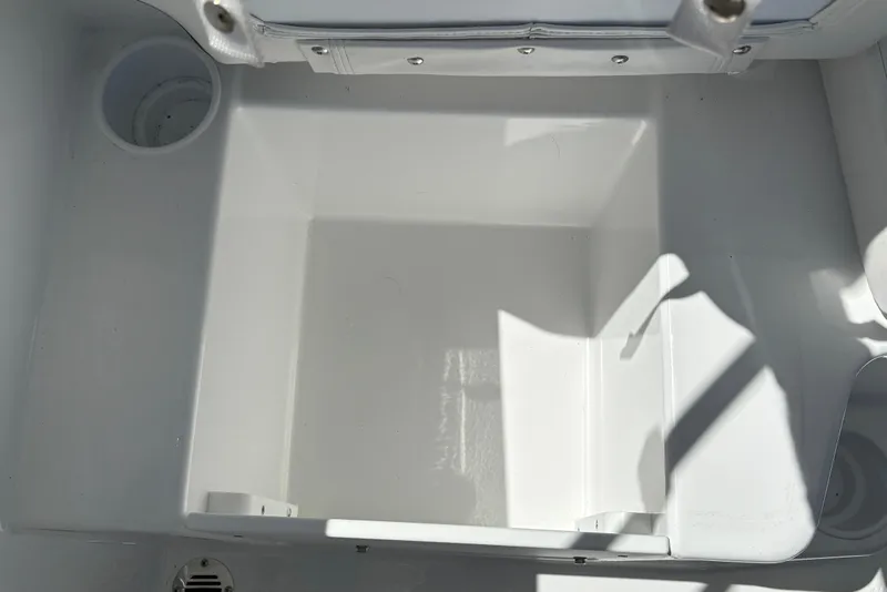 Slide: The Image of Interior compartment of 2026 Tahoe T16 boat, featuring white finish and cup holders. - 22