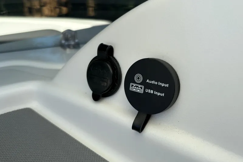 Slide: The Image of 2026 Tahoe T16 audio and USB input ports on a sleek white surface. - 25