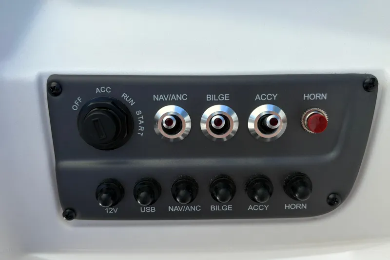 Slide: The Image of Control panel of 2026 Tahoe T16 boat with switches for NAV/ANC, bilge, accessories, and horn. - 27