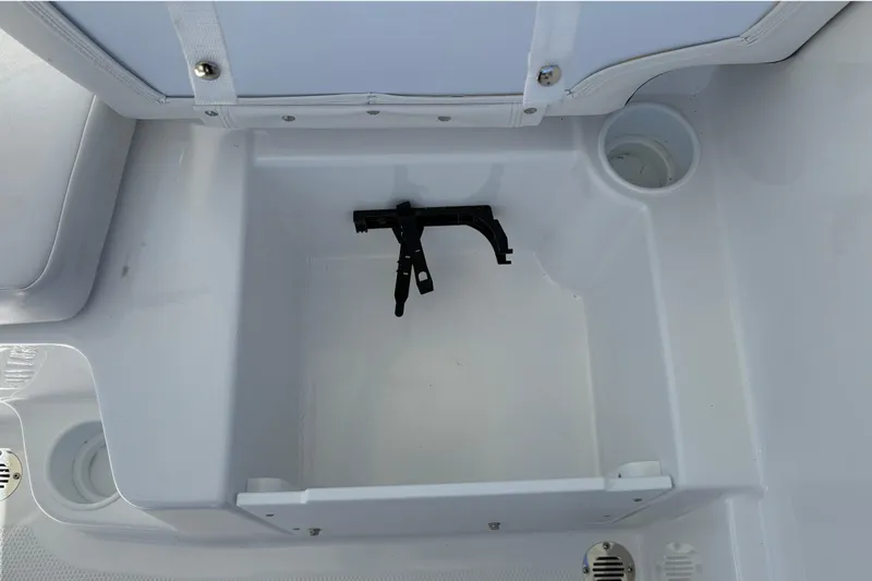Slide: The Image of Storage compartment in 2026 Tahoe T16 boat, featuring cup holders and a secure latch. - 23