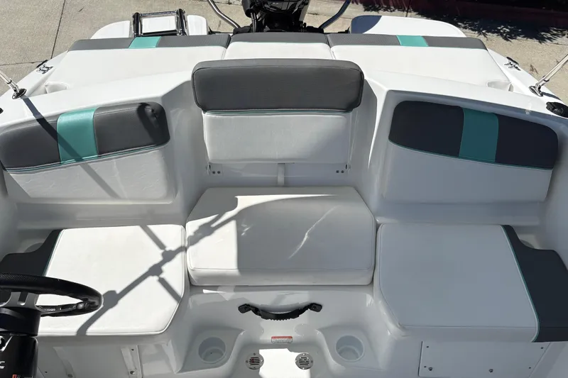 Slide: The Image of Interior seating of 2026 Tahoe T16 boat with white and teal accents. - 13