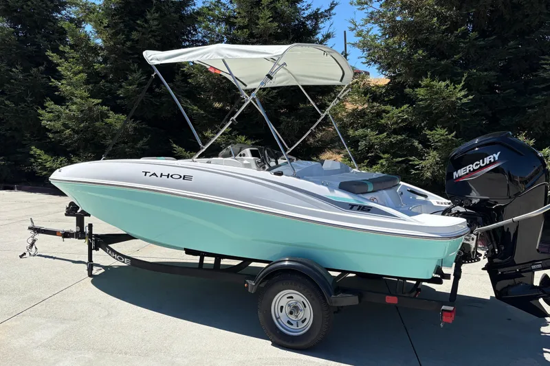 Slide: The Image of 2026 Tahoe T16 boat with canopy and Mercury outboard motor on trailer. - 5